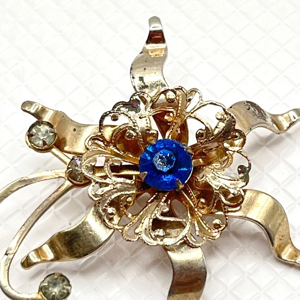 Vintage Gold Tone Flower Brooch w/ Blue and Clear Rhinestones